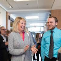 Lynn M. Blue speaking with guests at the Lynn M. Blue Connection Naming Ceremony